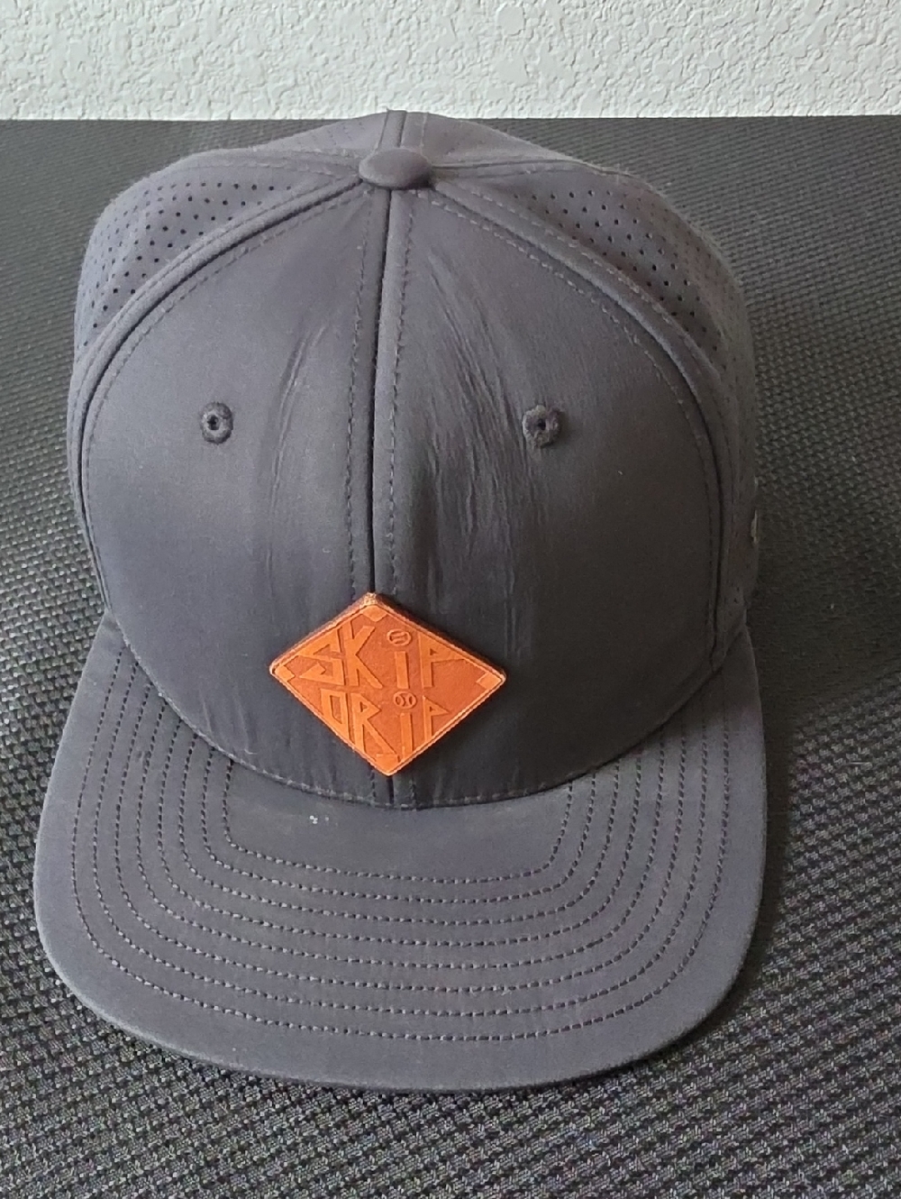 Black Men's Snapback Hat with Brown Leather Patch